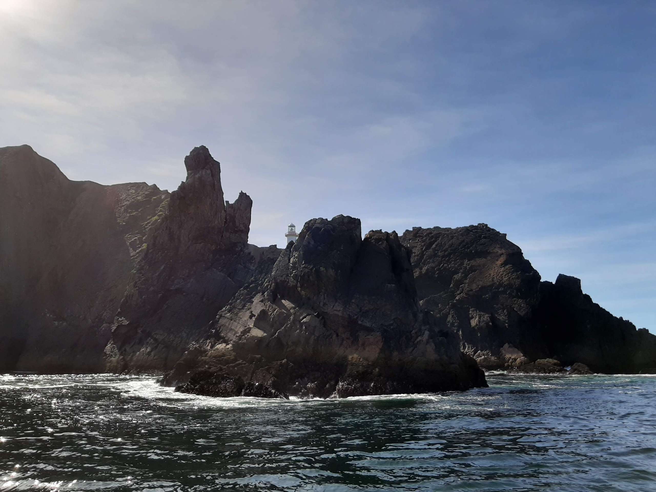 Sea Stacks with Arranmore Lighthouse, Arranmore Charters